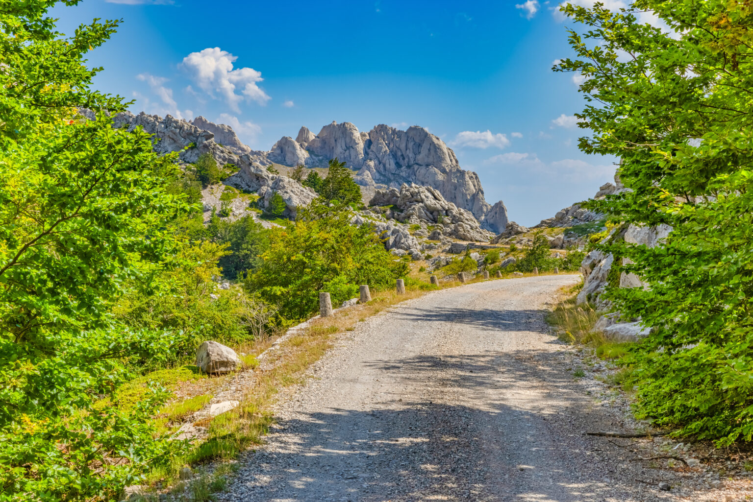 Famous Majstorska cesta road at mountain Velebit in summer time in Croatia wuth a view at Tulove grede top.